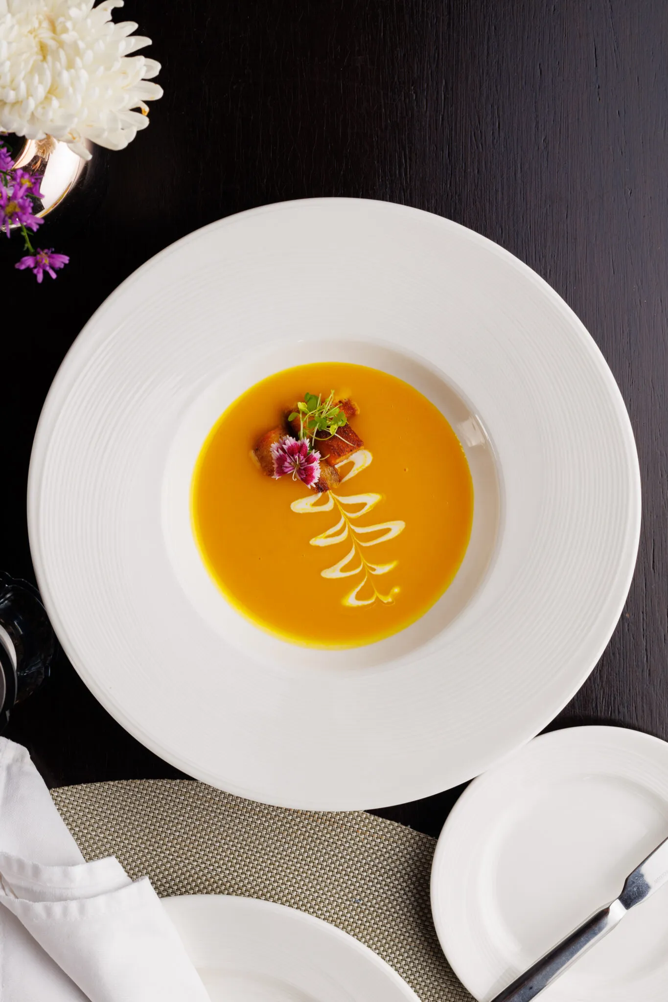 Aromatic pumpkin soup served inside a hollowed bread loaf with garlic croutons from the pillars restaurant menu tasting