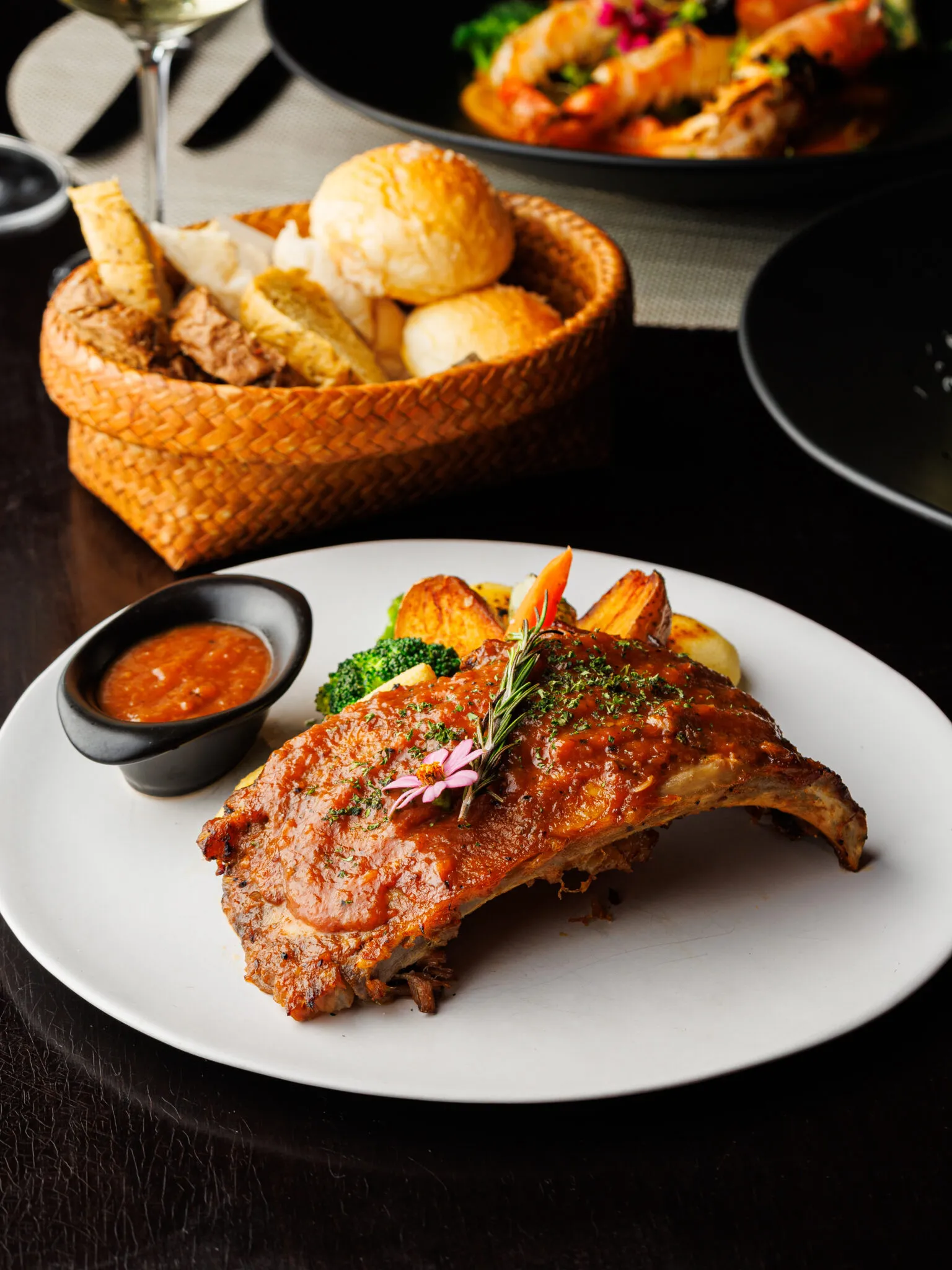 Roasted pork ribs with a bright apple sauce and side of winter vegetables from the Palette Restaurant menu