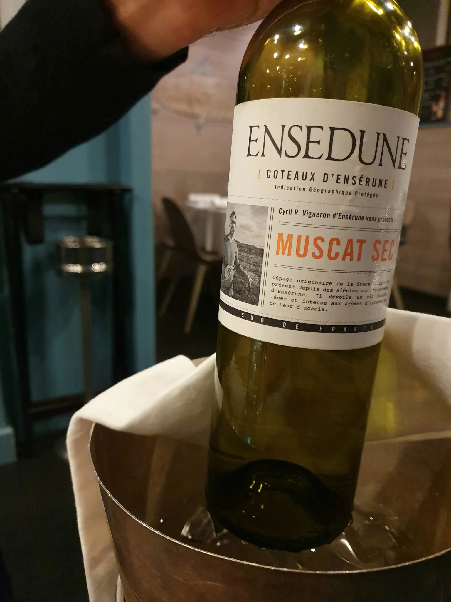A bottle of high-quality white wine, included as part of the generous et restaurant menu package