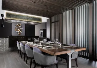 A stylized and modern dining room, likely representing the exclusive Chef's Room.