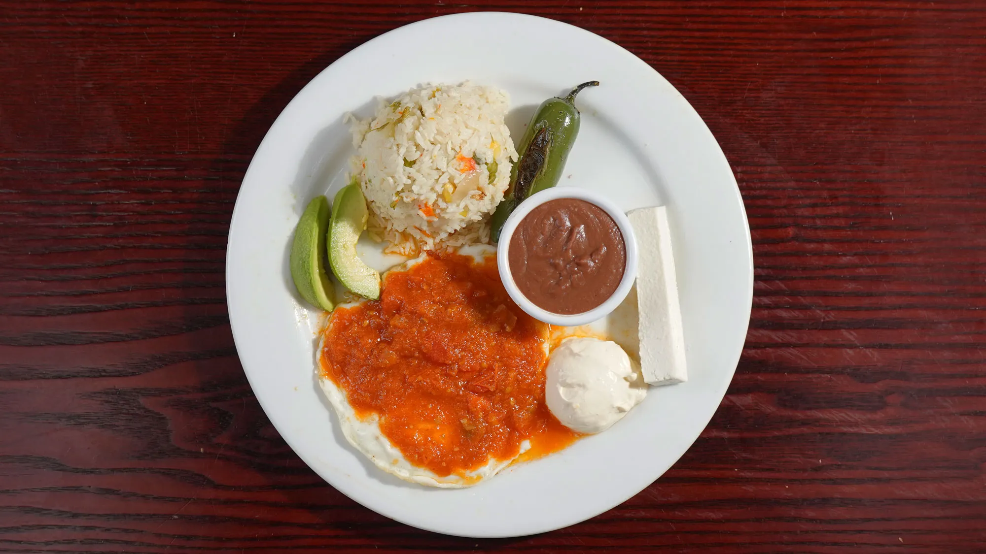 Rancheros eggs, a staple of Latin cuisine available on the armenia restaurant menu