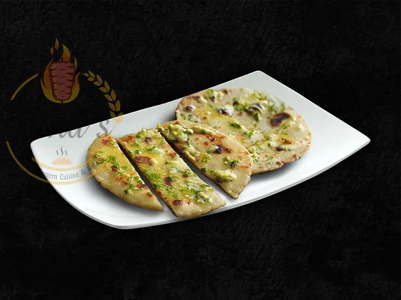 Savory Garlic Naan, a flavorful addition to the dina's restaurant menu