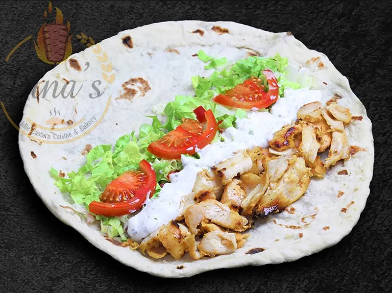 Tender Chicken Shawarma wrap, a highlight of the dina's restaurant menu