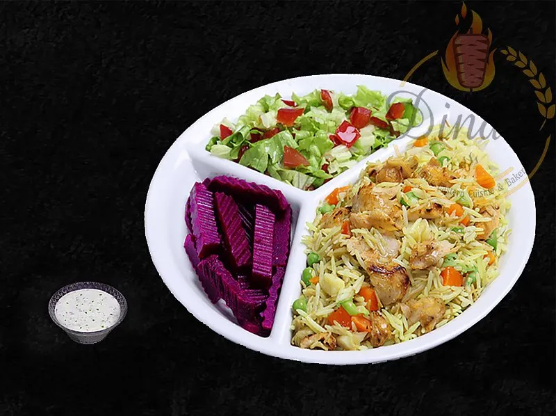Flavorful Chicken Biryani, an Iraqi specialty from the dina's restaurant menu