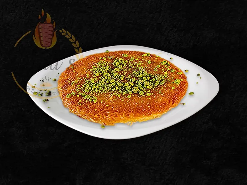 Traditional Kunafa, a sweet cheese pastry from the dina's restaurant menu