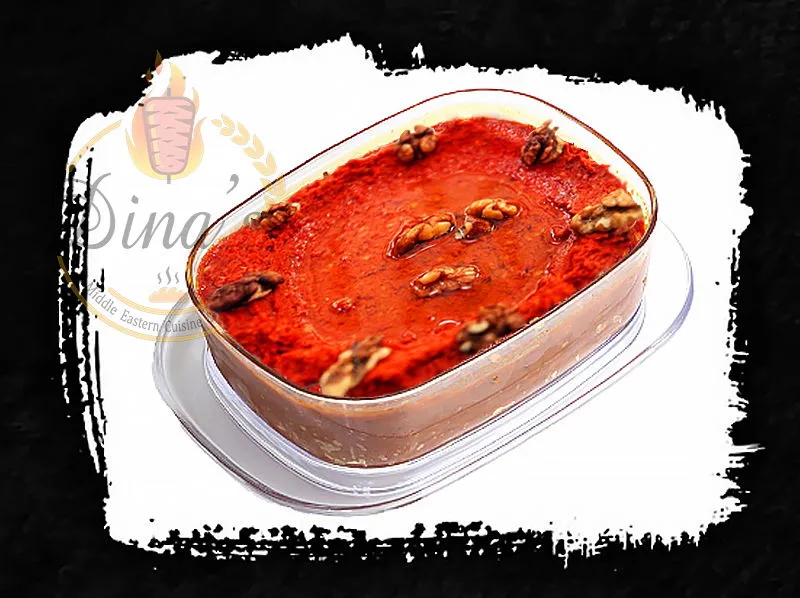 Vibrant Muhammara dip, a savory Syrian specialty on the dina's restaurant menu