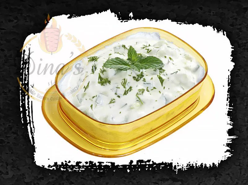 Cool and creamy Tatziki dip, a refreshing Greek addition to the dina's restaurant menu