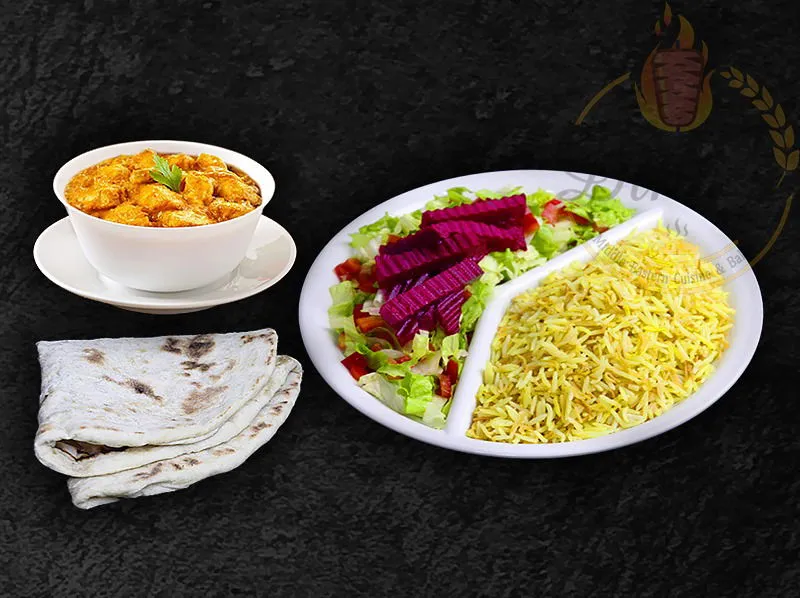 Rich Korma stew with chicken, a comforting dish on the dina's restaurant menu