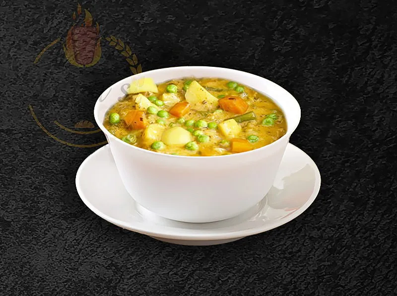 Frozen Veggie Korma stew, a delicious Indian-inspired vegetarian option from the dina's restaurant menu