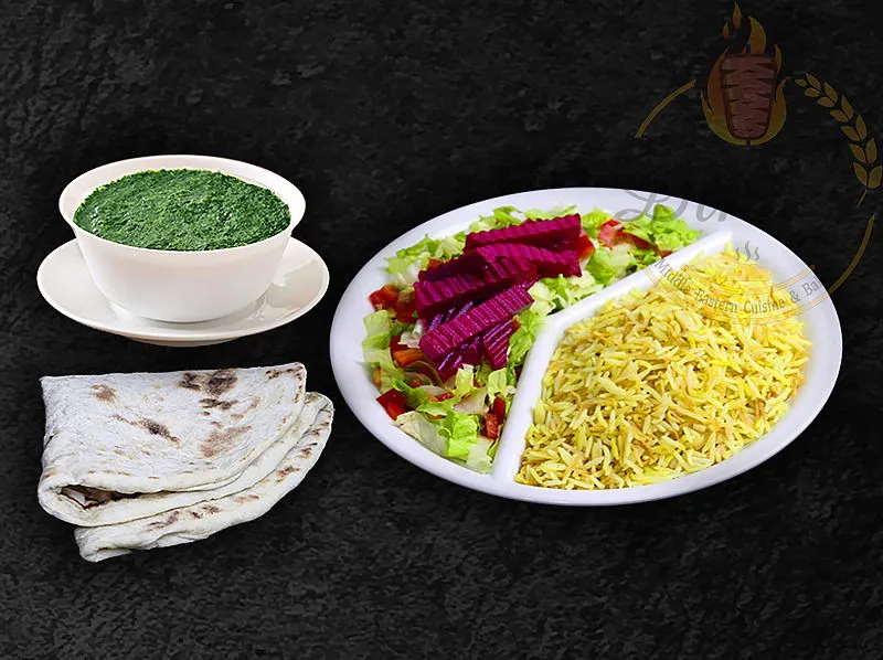 Traditional Sabzi stew, a flavorful Persian herb dish from the dina's restaurant menu