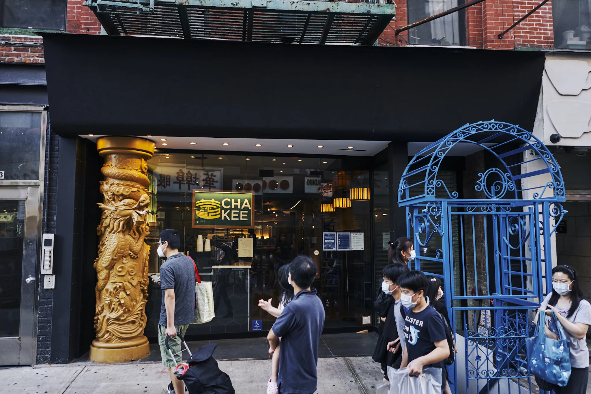 Exterior view of a unique Chinese restaurant, signaling a destination for innovative Asian culinary experiences in a bustling city environment.