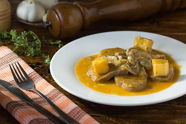 Hearty braised ox-tongue, a robust meat offering on a traditional cebu restaurant menu.