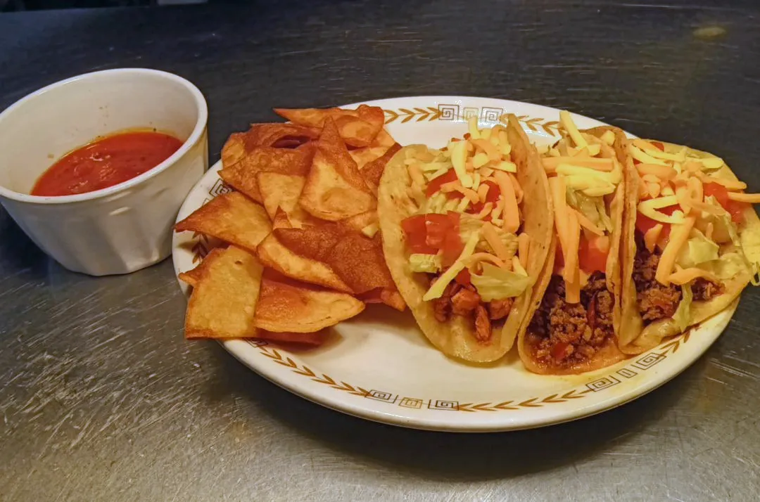 Tacos Chips and Salsa, demonstrating the varied comfort food available on the 810 Munchies restaurant menu