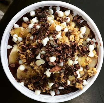 An Acai bowl on Maui with white chocolate and cacao nibs topping.