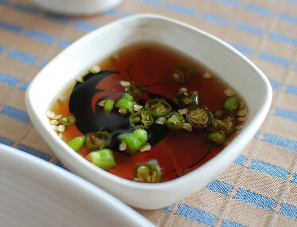 A jar of vegan 'fish' sauce made from mushroom to replicate umami in chinese restaurant menu dishes