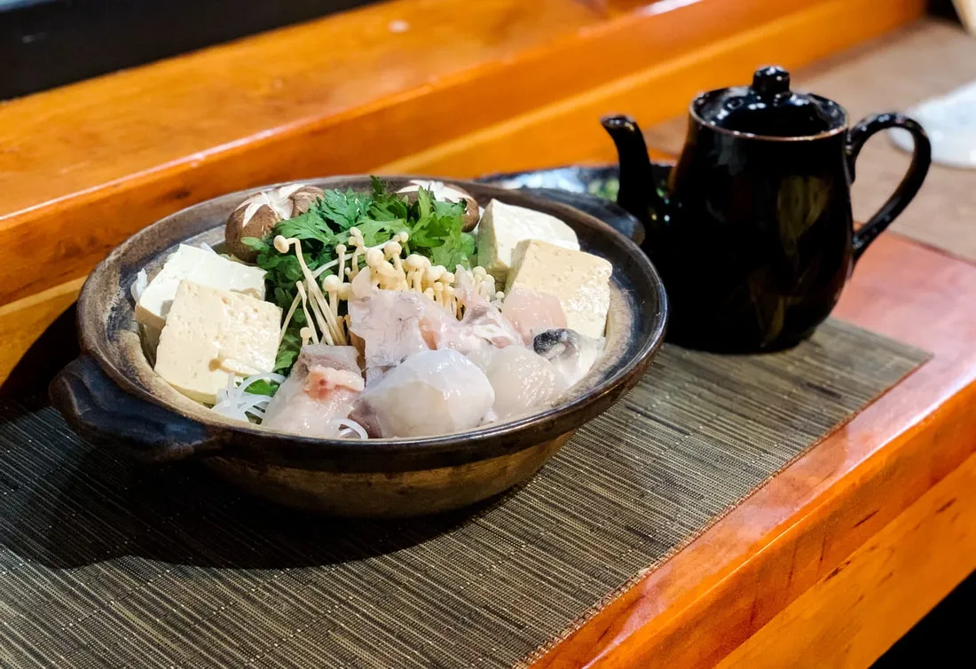 Exquisite fugu sashimi presented as part of the allintitle:shiki japanese restaurant menu's omakase course
