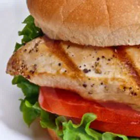 A grilled chicken breast sandwich on a toasted bun, featured on the Marion restaurant menu.