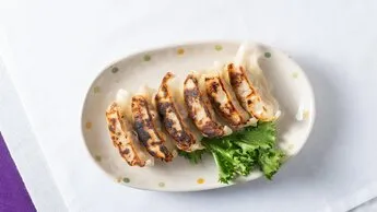 Gyoza dumplings, a classic pan-fried appetizer from the shiki japanese restaurant menu