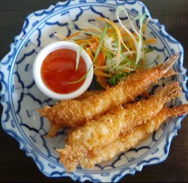 A beautifully plated Thai curry dish, emphasizing the presentation of the allintitle:sawadee restaurant menu
