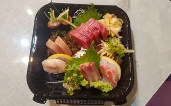 An artfully arranged Sashimi Dinner, showcasing fresh seafood, available on the shiki japanese restaurant menu