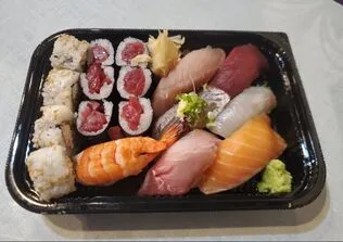 A beautiful Sushi Combination plate, featuring various nigiri and rolls, from the shiki japanese restaurant menu