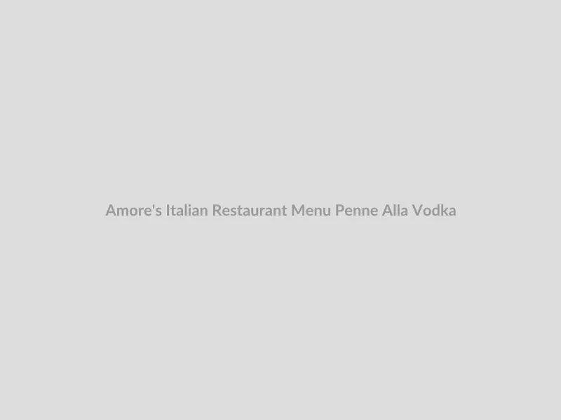 Creamy Penne Pasta alla Vodka garnished with fresh parsley and a side of crusty bread