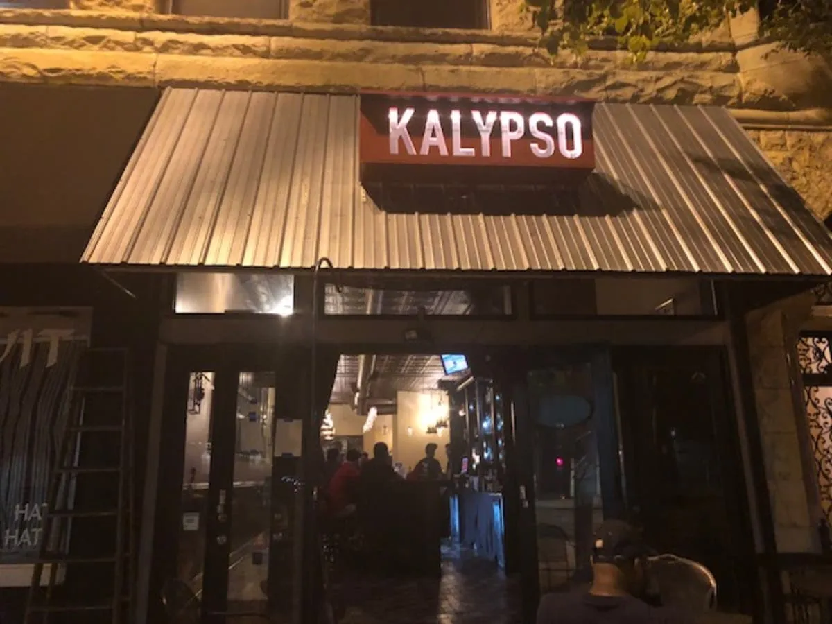 Kalypso Restaurant menu sign in downtown Joliet