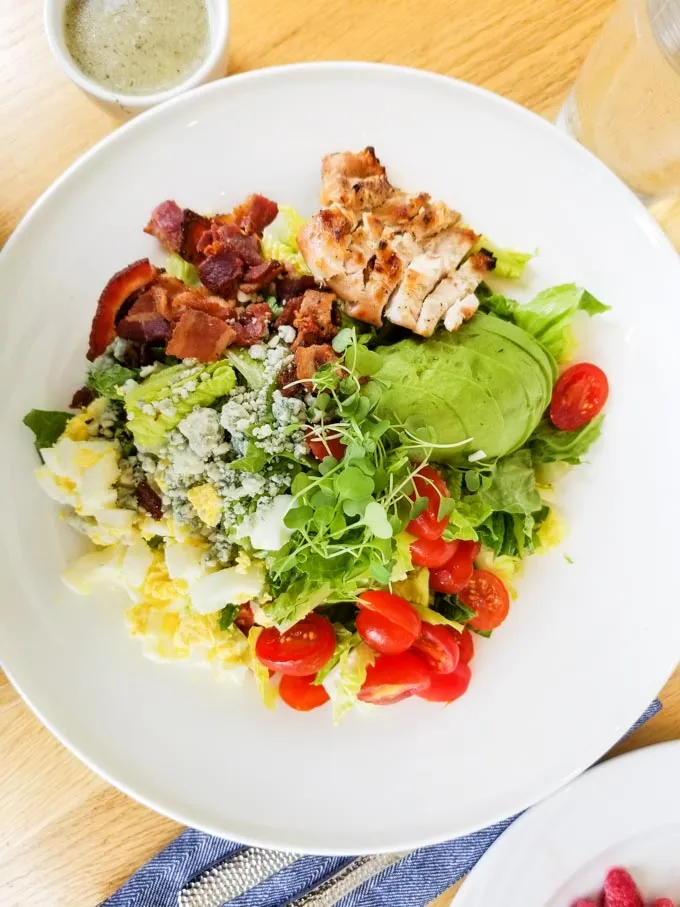 A perfectly plated gluten-free Cobb Salad at LakeHouse, a top allintitle:cypress restaurant menu offering