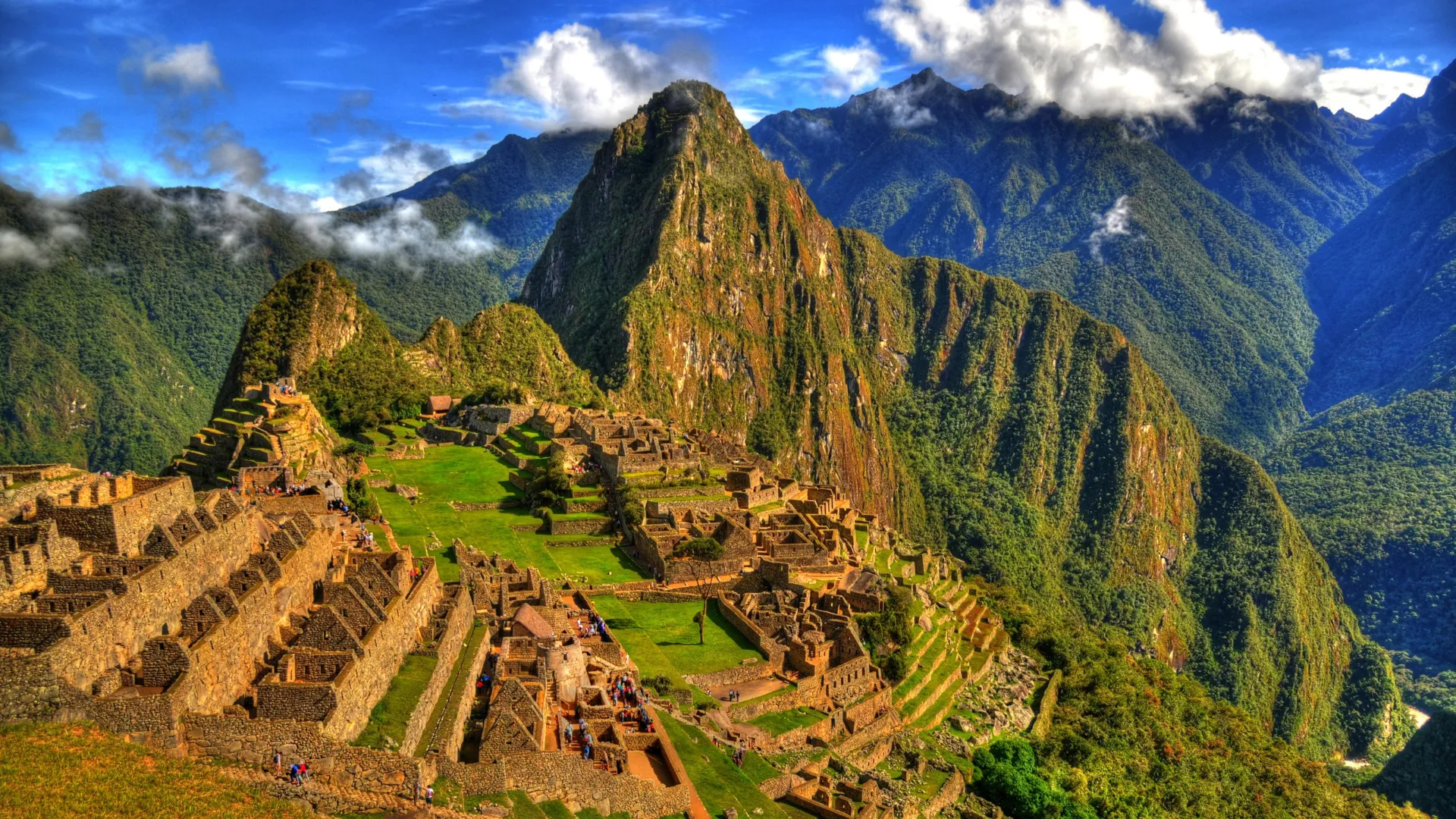 An atmospheric shot of the ancient city of Machu Picchu shrouded in mist, emphasizing its mystical quality