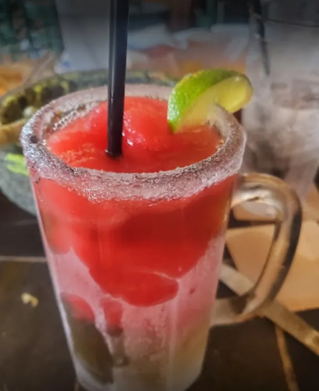 A classic Margarita served in a salt-rimmed glass, demonstrating the quality of the mexican restaurant drink menu.