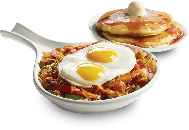 Meat Lover’s Skillet topped with two fresh farm eggs