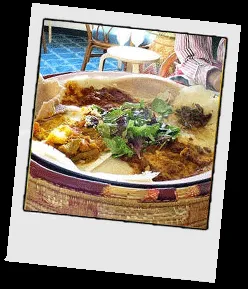A traditional Eritrean dish with chicken stew (Tsehbhi Derho) and injera flatbread
