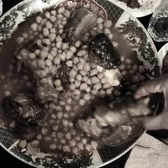 Hearty Moroccan Lkor3in, a traditional dish of slow-cooked sheep feet, offering a glimpse beyond typical Moroccan restaurant menu selections