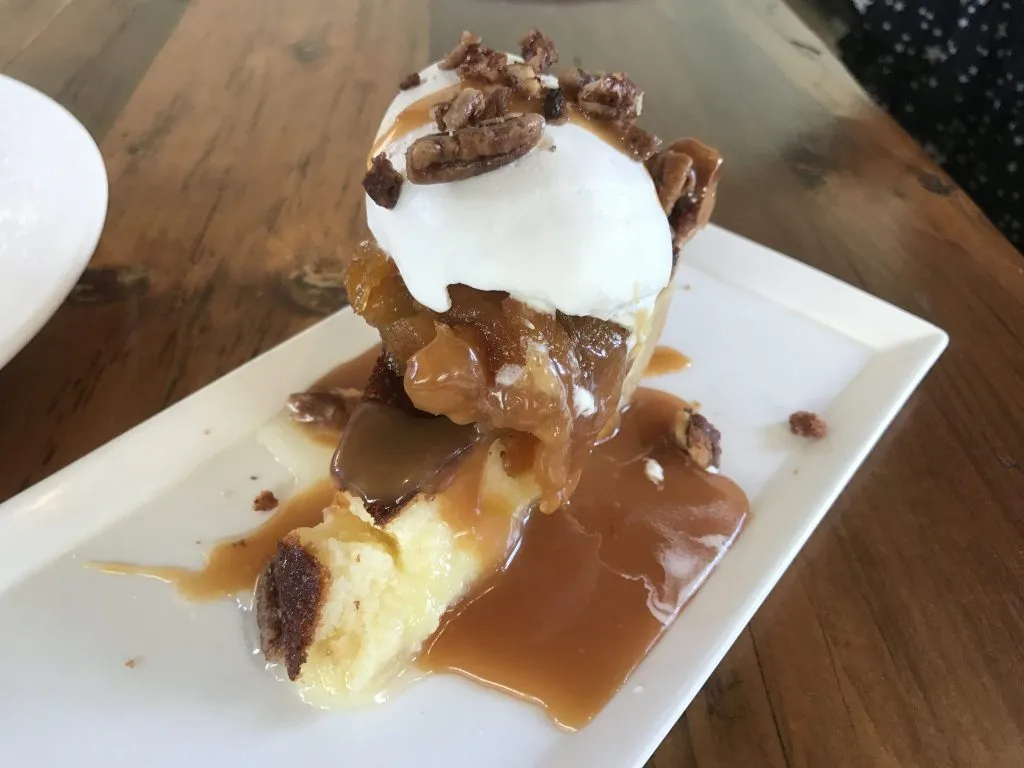 A rich and creamy Buttermilk Pie, a quintessential Southern delight featured on the moxie's restaurant menu
