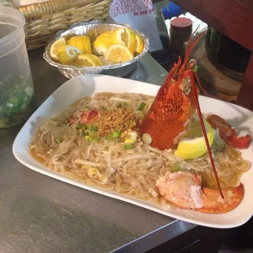 Plates of famous Pud Thai and Drunken Noodles from the menu