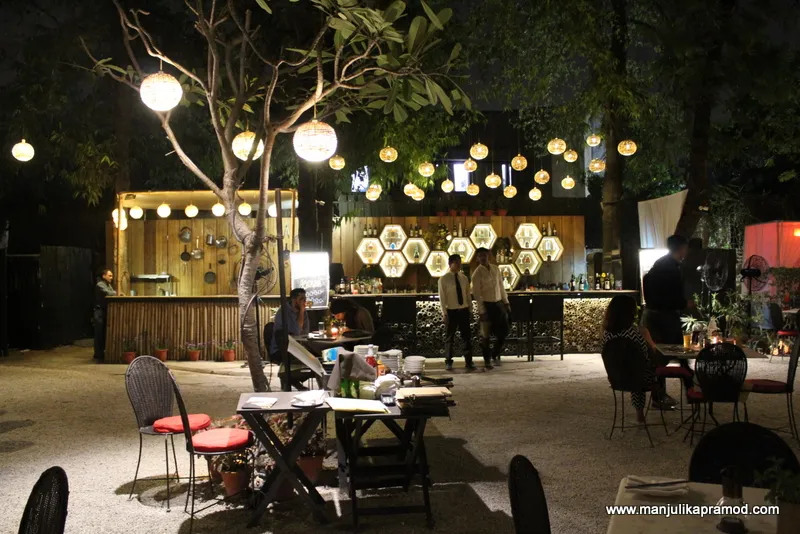 Open dining area of a garden restaurant, illustrating the farm-to-fork ethos