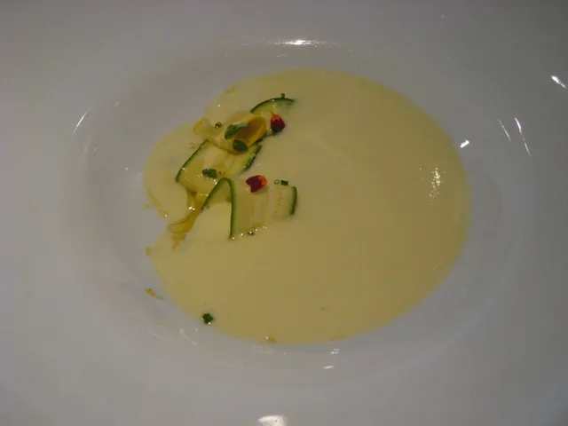 A beautifully presented chilled zucchini soup at Ai Fiori, adorned with delicate zucchini slices, showcasing the refined appetizer offerings on the ai fiori restaurant week menu