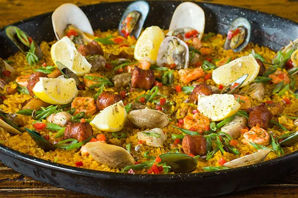 A vibrant Paella de la Casa, highlighting the rich flavors found in a comprehensive cebu restaurant menu.