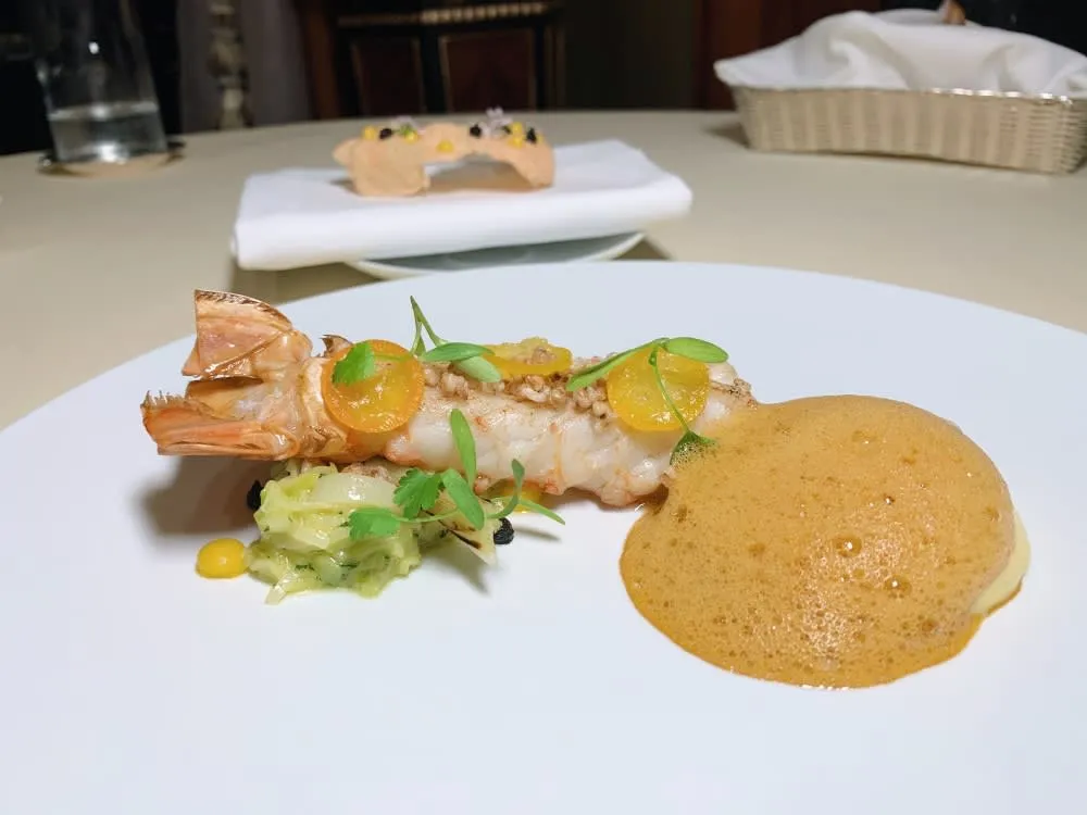 Brittany langoustine dish with kumquat and leek, a highlight of the petrus restaurant menu seasonal offerings