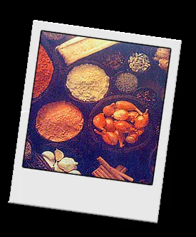 Platter of various Eritrean appetizers including stuffed peppers and a serving of injera fitfit