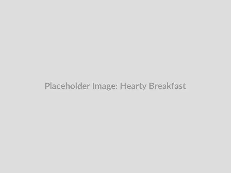 A classic image of a hearty breakfast plate with eggs, toast, and hash browns at Toni's Family Restaurant