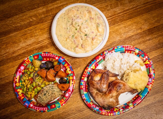 Hearty shrimp and grits dish with smoked ham and cream sauce, a satisfying choice from an mega restaurant menu.