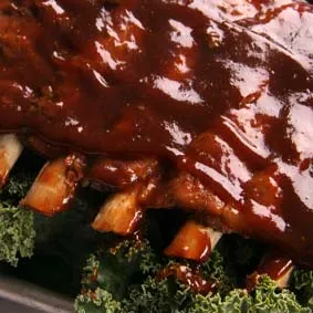 A delicious plate featuring St. Louis-Style BBQ Ribs and BBQ Chicken Breast, a popular combination from the Marion menu.