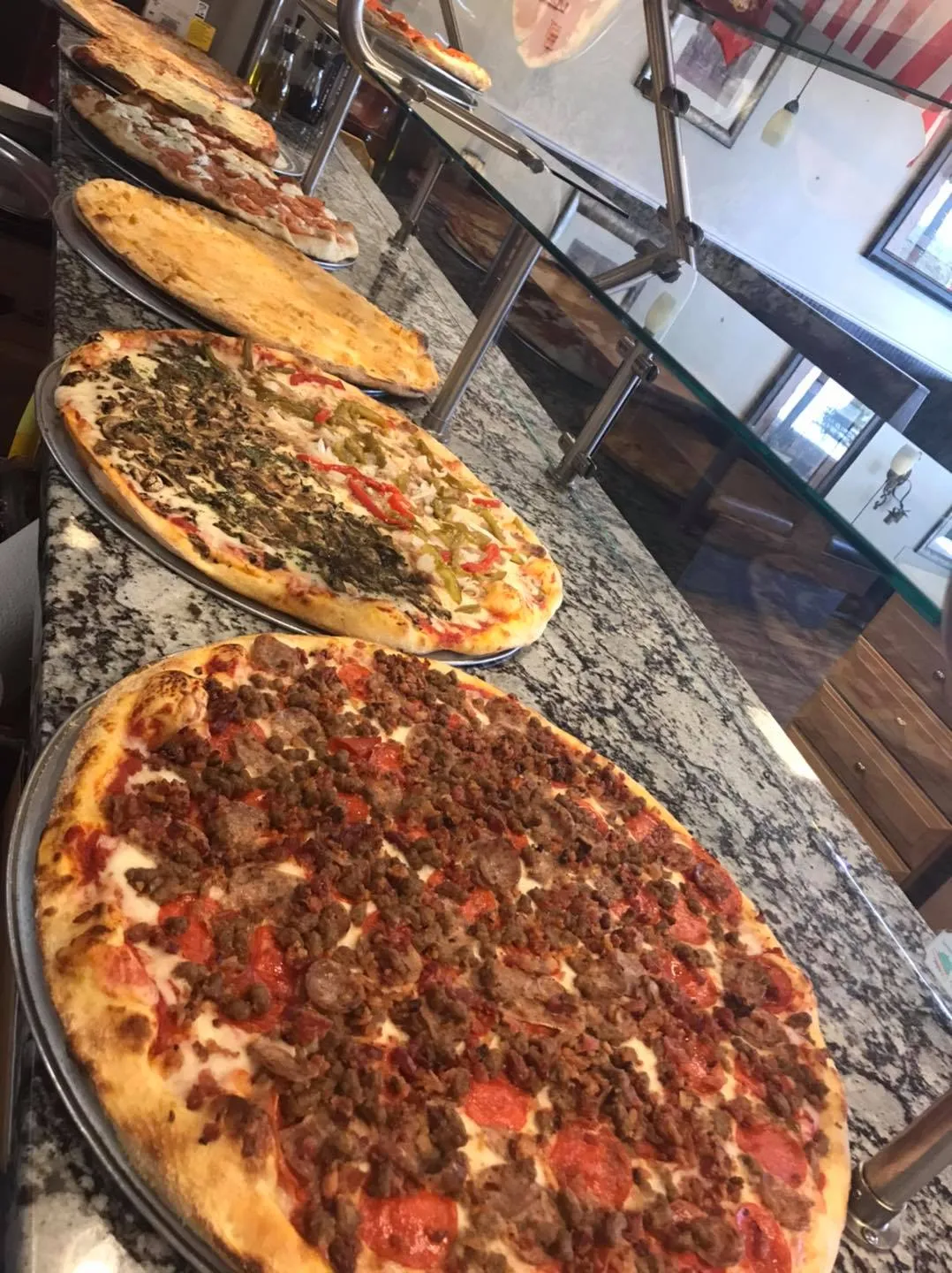 row of pizza image