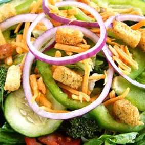 A vibrant mixed green salad, known as the Park Avenue Salad, showcasing fresh produce from the Marion menu.