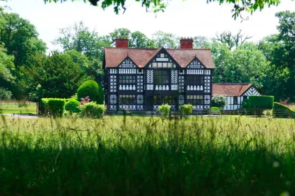 The picturesque Tudor architecture of Paris House set amidst the expansive Woburn Estate grounds