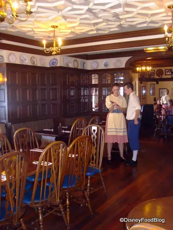 Rose & Crown Dining Room Seating Area with Cast Members - The Crown Restaurant Menu