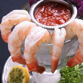 A sophisticated Jumbo Shrimp Cocktail Supreme appetizer from the Marion restaurant menu.