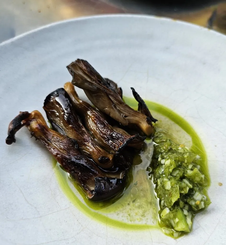 A detailed shot of the perfectly prepared oyster mushrooms, a highlight of the otto menu