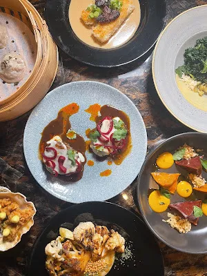 A selection of the seven-course Restaurant XO menu items arranged on a table